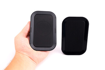 bluetooth portable stereo speakers in human hand
