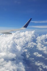 Obraz premium Beautiful view blue sky and white clouds from the airplane | Window seat passenger view 