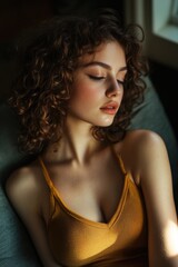 Naklejka premium Young Woman Sitting on Couch