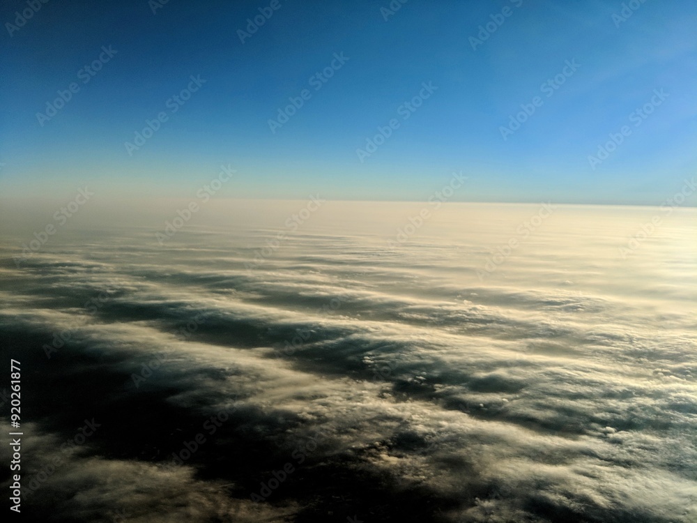 Wall mural wave-like clouds