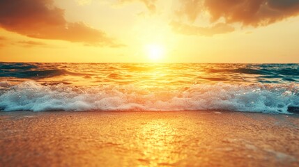 Fototapeta premium Breathtaking sunset over the ocean, with gentle waves lapping at the shore and a warm glow illuminating the serene landscape.