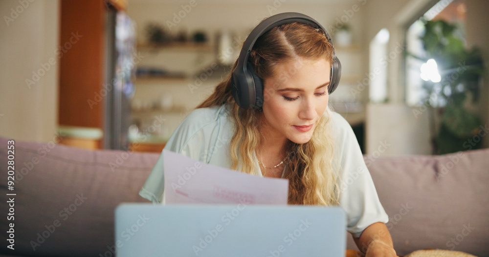 Wall mural Woman, laptop and headphones with document at house for financial planning, review budget and streaming music. Girl, relax and digital with paperwork for mortgage payment, debt report and bank notice