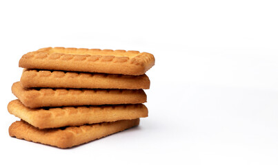 Indian biscuits stacked over white background