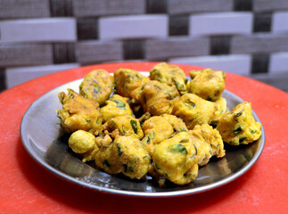 Popular street food item mix bhajiya snacks or Pakoda or Pakora