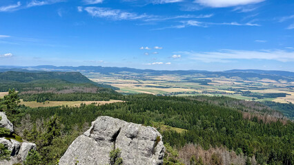Landscape, view from the mountain to a mountain valley with fields and meadows. Poland