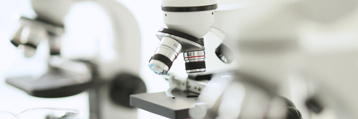 White microscopes standing in row in laboratory