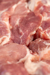 a sliced piece of pork meat from the neck