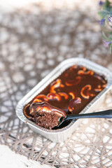 chocolate cake with cashew nuts in a tray