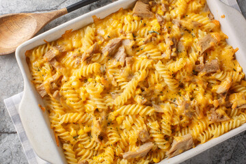 Tuna Mornay Creamy Tuna Casserole  fusilli Pasta Bake  closeup on the baking dish on the table....