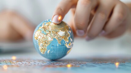 Hand Spinning Modern Globe and Pointing to Various Destinations on the World Map