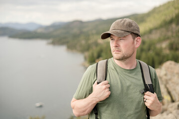 White male hiker overlooking a view