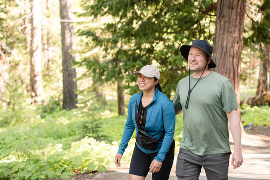 Couple smiling together outdoors in the woods