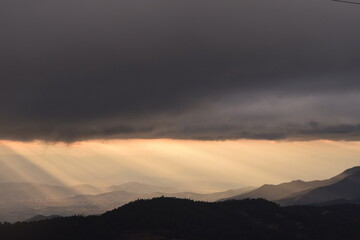 View of sunset light in cloudy sky over mountains Oaxaca, Mexico