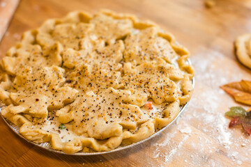 Close up of handmade chicken pot pie with fall leaves