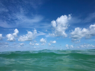 Close up turquoise water and white clouds Gulf of Mexico
