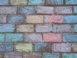 A fragment of a wall lined with stone blocks and painted with chalk.