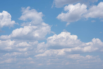Fototapeta premium Fluffy clouds on the blue sky. 