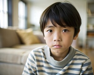 Portrait of a Young Boy with a Serious Expression.