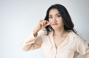 Asian woman asking for your cooperation to keep silent, make no noise with angry and furious...