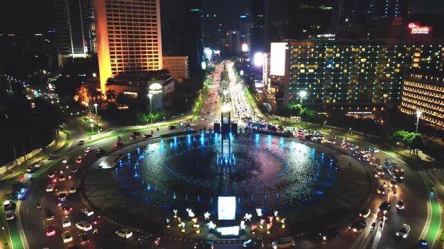 Aerial view of traffic at night at the Hotel Indonesia roundabout - Jakarta.