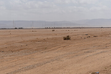 Djibouti military truck convoy driving on a desert road in Djibouti, Africa