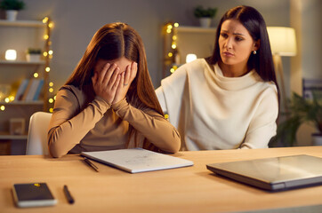 Frustrated teen girl closing face with hands, feeling sad, annoyed or not confident. Mother supporting daughter in study, life problem, mistake, cyberbullying, puberty, social and school pressure