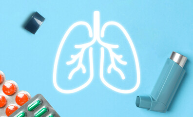 Asthma inhaler, drugs and illustration of lungs on light blue background, flat lay