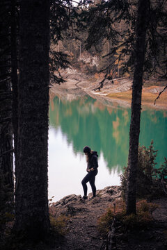 Young Woman Enjoys Serene Moment by Mountain Lake in Montenegro