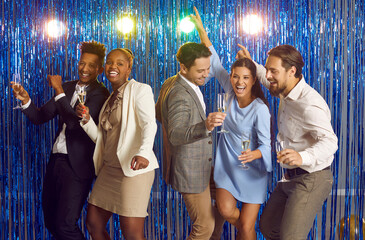 Group of diverse friends having fun at disco party. Five happy cheerful mixed race multiethnic...