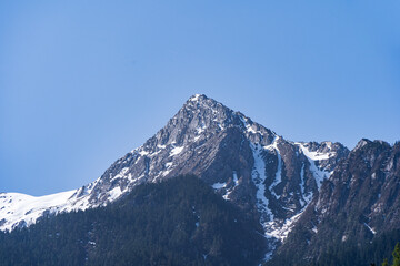 Snowy mountain peak in Jiuzhaigou National Park, China