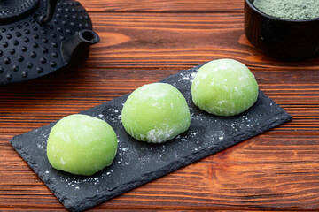 Traditional japanese desert mochi with matcha latte tea
