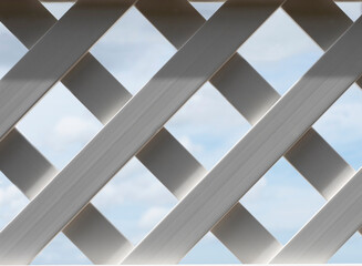 Fragment of a wooden fence against a blue sky