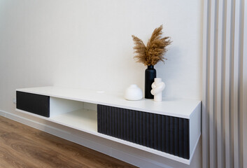 A beautifully designed Modern and Minimalist Wall Shelf, showcasing decorative vases for an elegant...