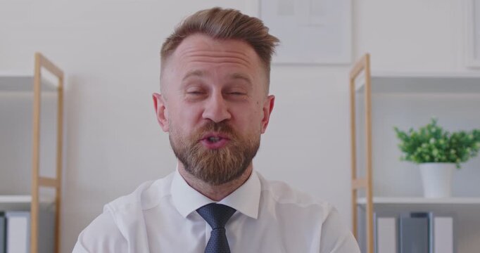 Online video call headshot happy friendly smiling man business expert top manager in white shirt and tie who waves hello, gives short interview, makes brief commentary, shares opinion and says goodbye