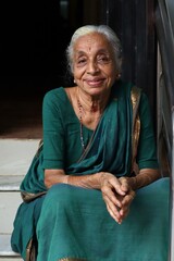 portrait of a senior woman with a saree