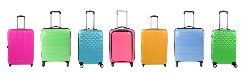 Stylish suitcases of different colors on white background, set