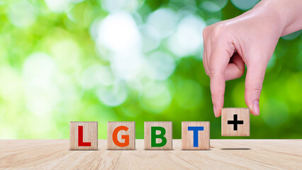 LGBTQ, Concept of Lgbt rights and law, wooden blocks with Text LGBTQ, symbol of law and justice in...