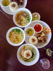 Top view of chicken based food. Chicken rice, chicken porrige and chicken noodles on the table.