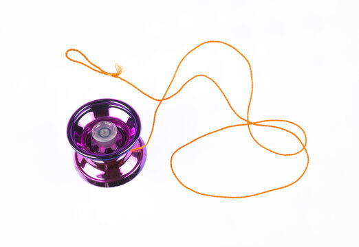 purple yo yo toy isolated on white background