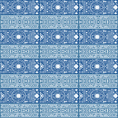 A seamless tribal-inspired geometric pattern in blue and white, perfect for textiles, wallpaper, or decorative designs.