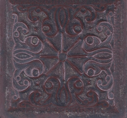 ceramic tiles with dark ornamental pattern