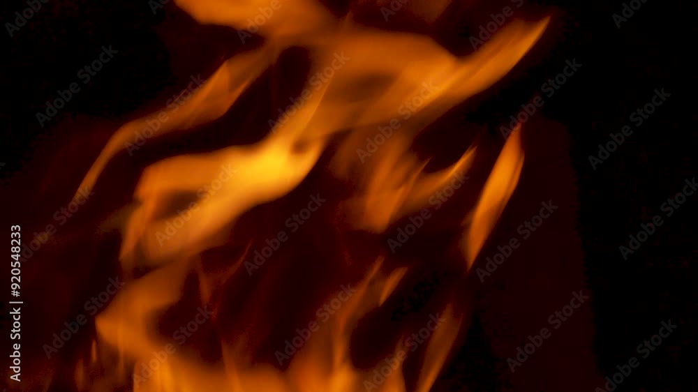 Poster close up of fire flames burning wood logs in slow motion reaching hot temperature and creating abstr