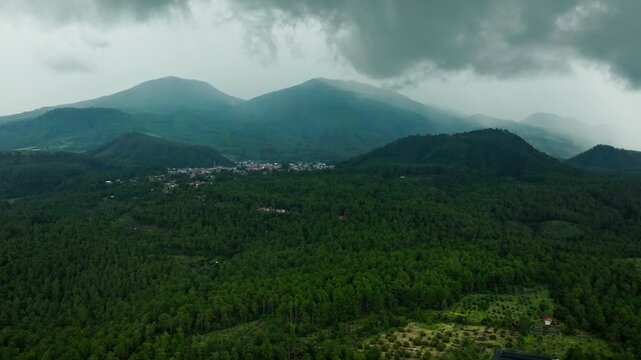 DRONE SHOT OF ANGAHUAN IN URUAPAN MICHOACAN ON A CLUDY DAY WITH THUNDERSTORMS