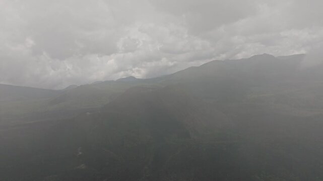 DRONE SHOT: REVEAL SHOT OF PARICUTIN VOLCANO FROM A CLOUD