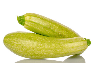 Two ripe zucchini, macro, isolated on white background.