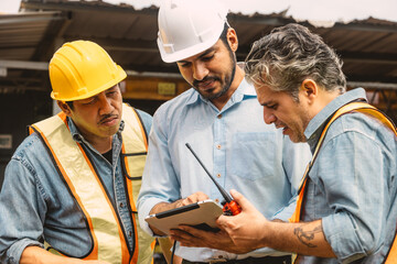 Professional construction engineer workers team working cooperate together consulting looking at...