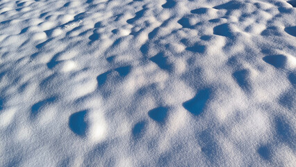 ground covered with snow in sunlight