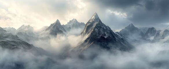 Majestic Snowy Mountain Peaks Emerging From Misty Clouds