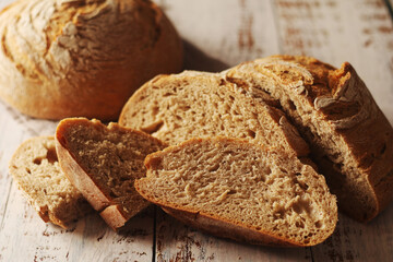 A loaf of rye bread in low key