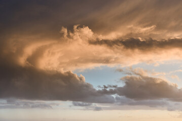 Beautiful vibrant sunset clouds with blue sky
